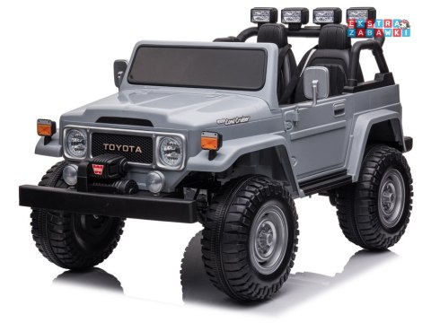 Toyota Land Cruiser dwuosobowa na akumulator - szary, 4x100W 24V/7Ah, EVA, ekoskóra, 3-punktowe pasy, pilot [PA0285]